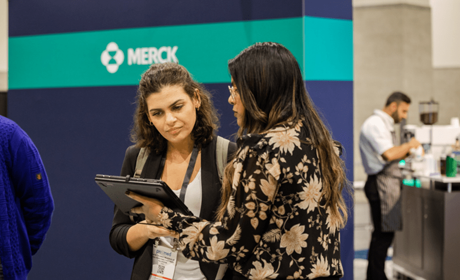 interaction between two women in the exhibit hall