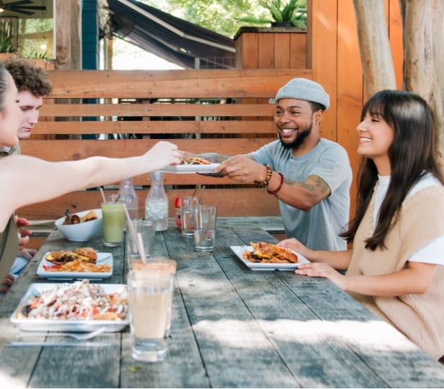 people enjoying food in dallas texas